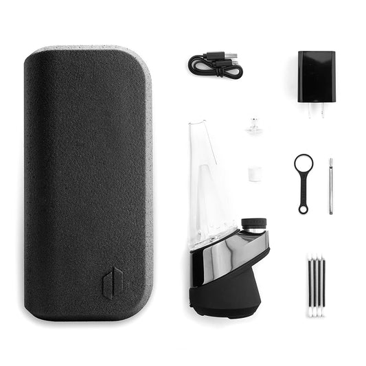 The Puffco Peak next to all the accessories.